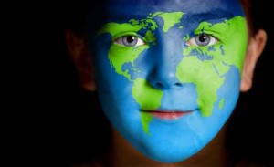 Portrait of a child with a painted world map